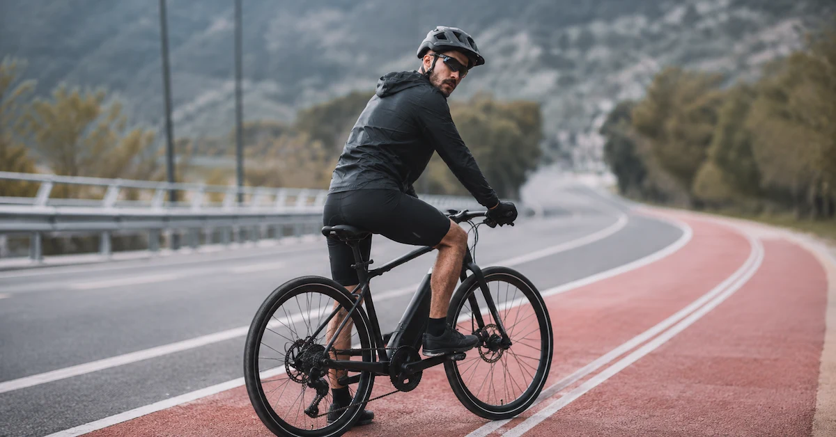 road e-bike rider on mountain bike lane